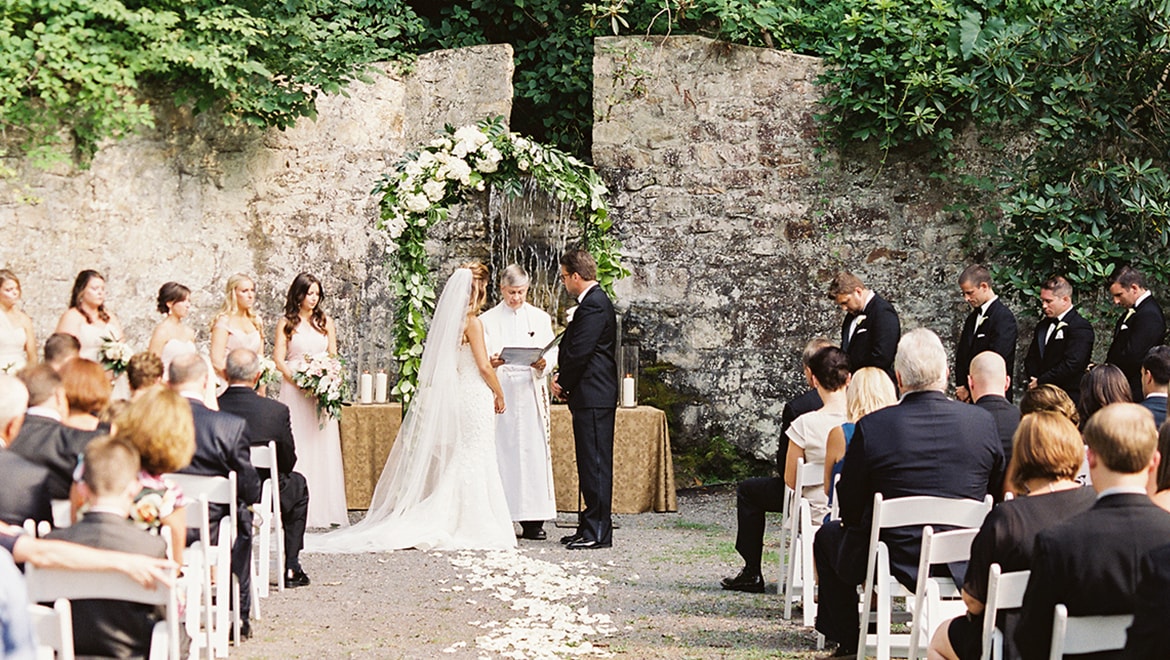 People getting married outdoors.