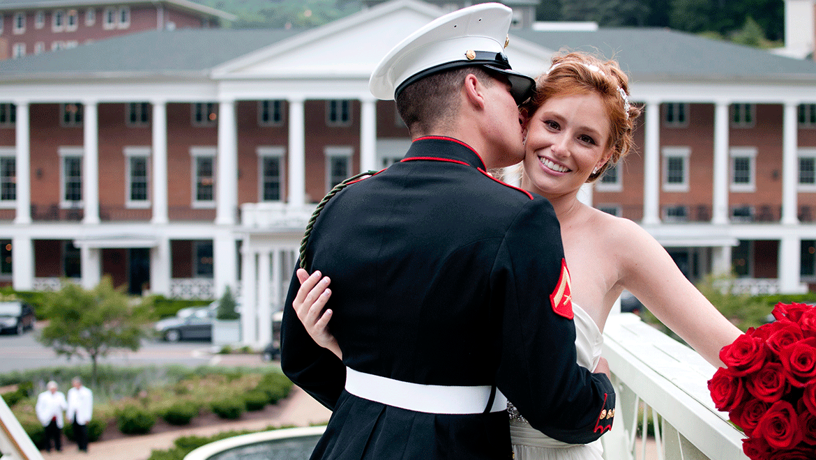 Bride and groom on bridge