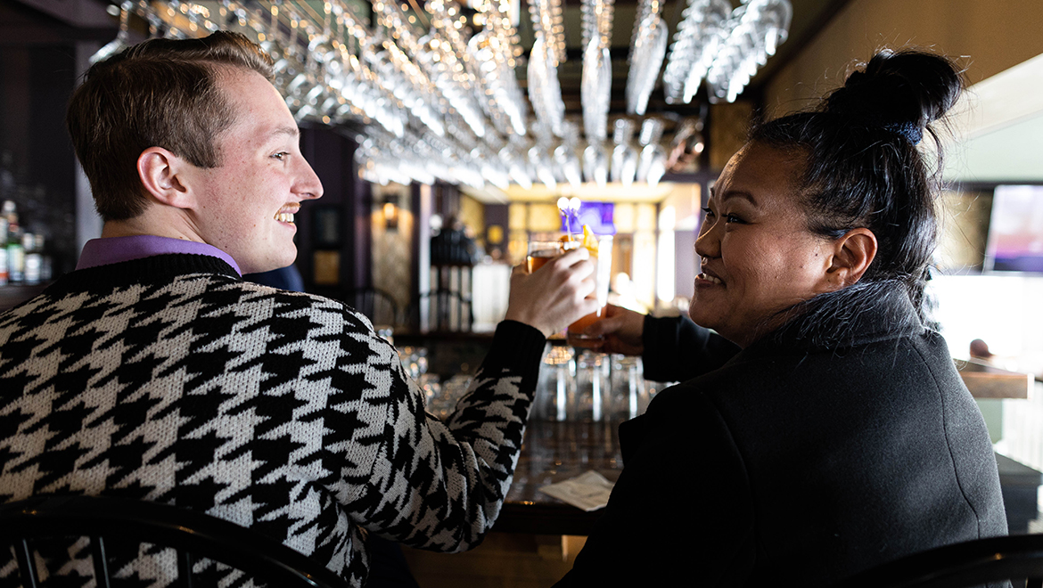 People talking at bar.