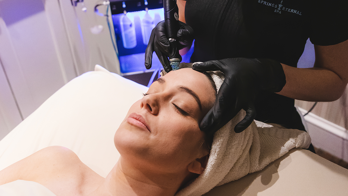 Woman receiving facial