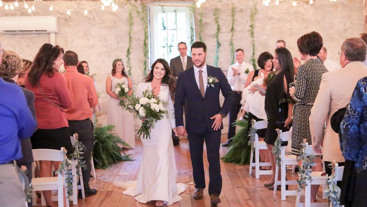Couple walking down the isle.