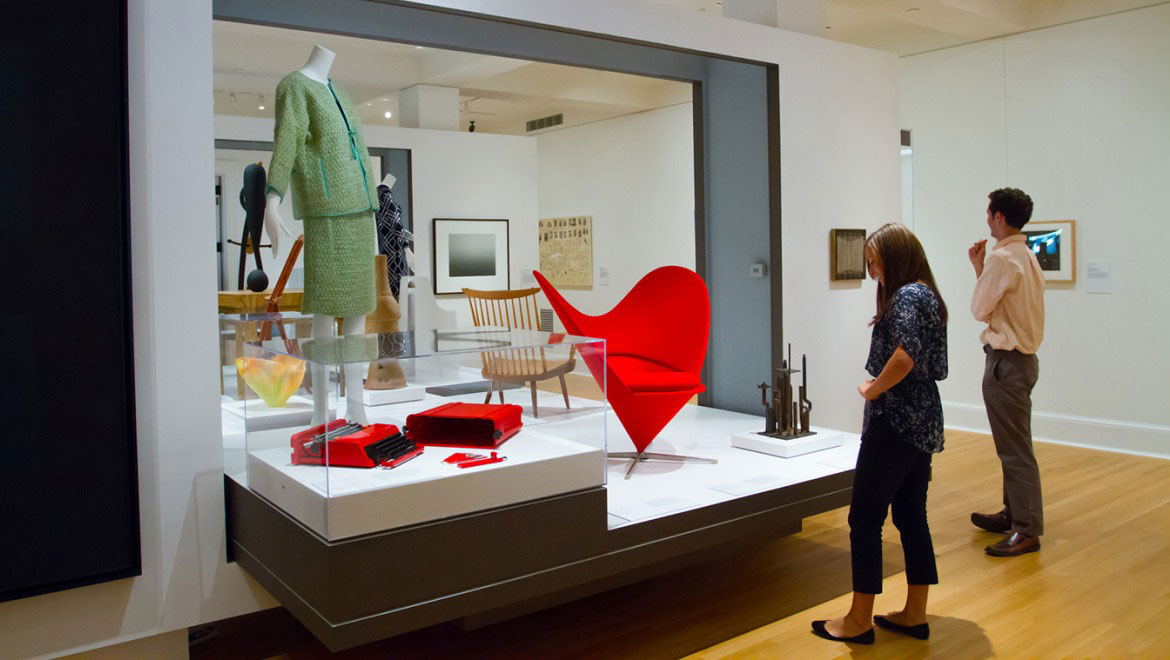 People looking at art display.