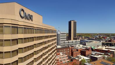 Aerial view of hotel and city.