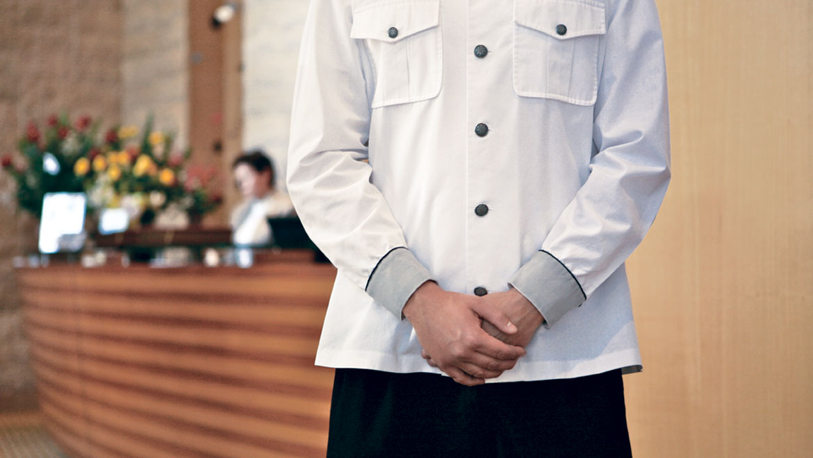 Person standing near front desk