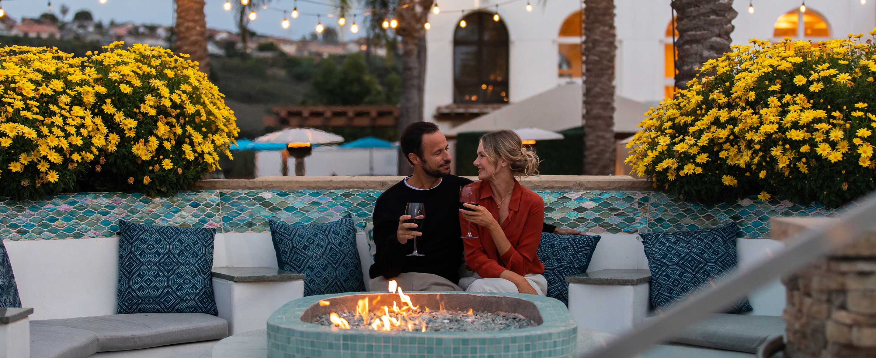 Couple sitting by a firepit