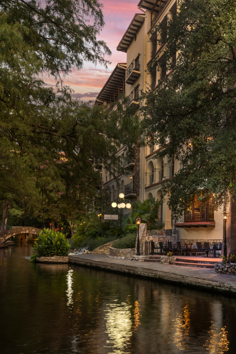 Mokara Hotel & Spa exterior night view by the San Antonio Riverwalk