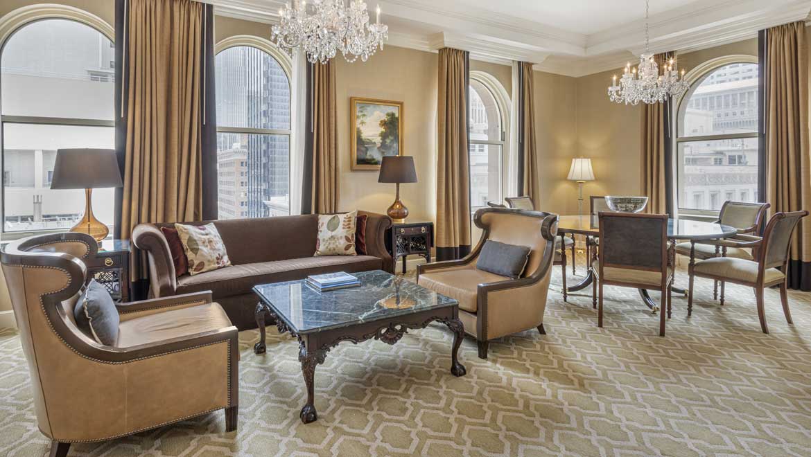 Suite living room with large windows.