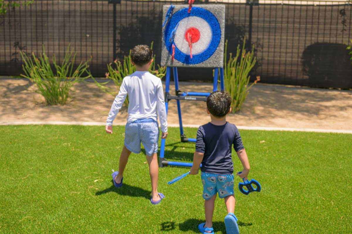 Little boys shooting arrows