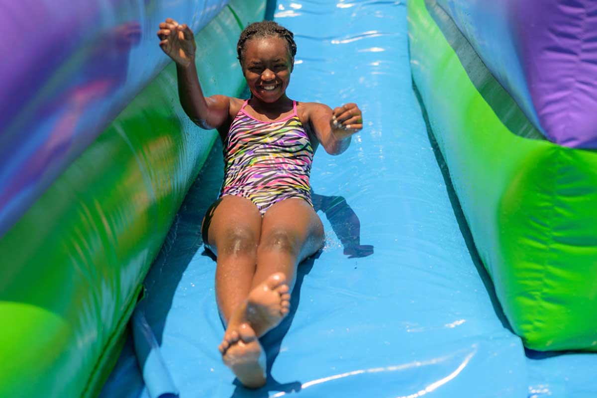 Child sliding down a waterslide