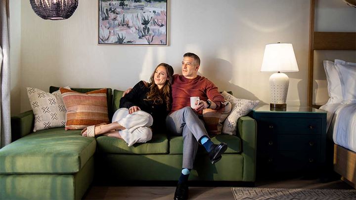 Couple relaxing in hotel room